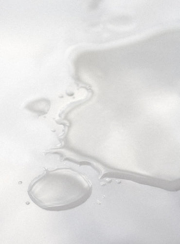 Close-up of hydrating toner texture on a white background.