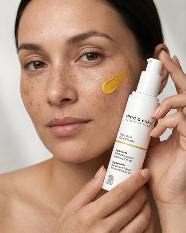 Woman holding Kojic Acid Face Cream by alltid & enkel