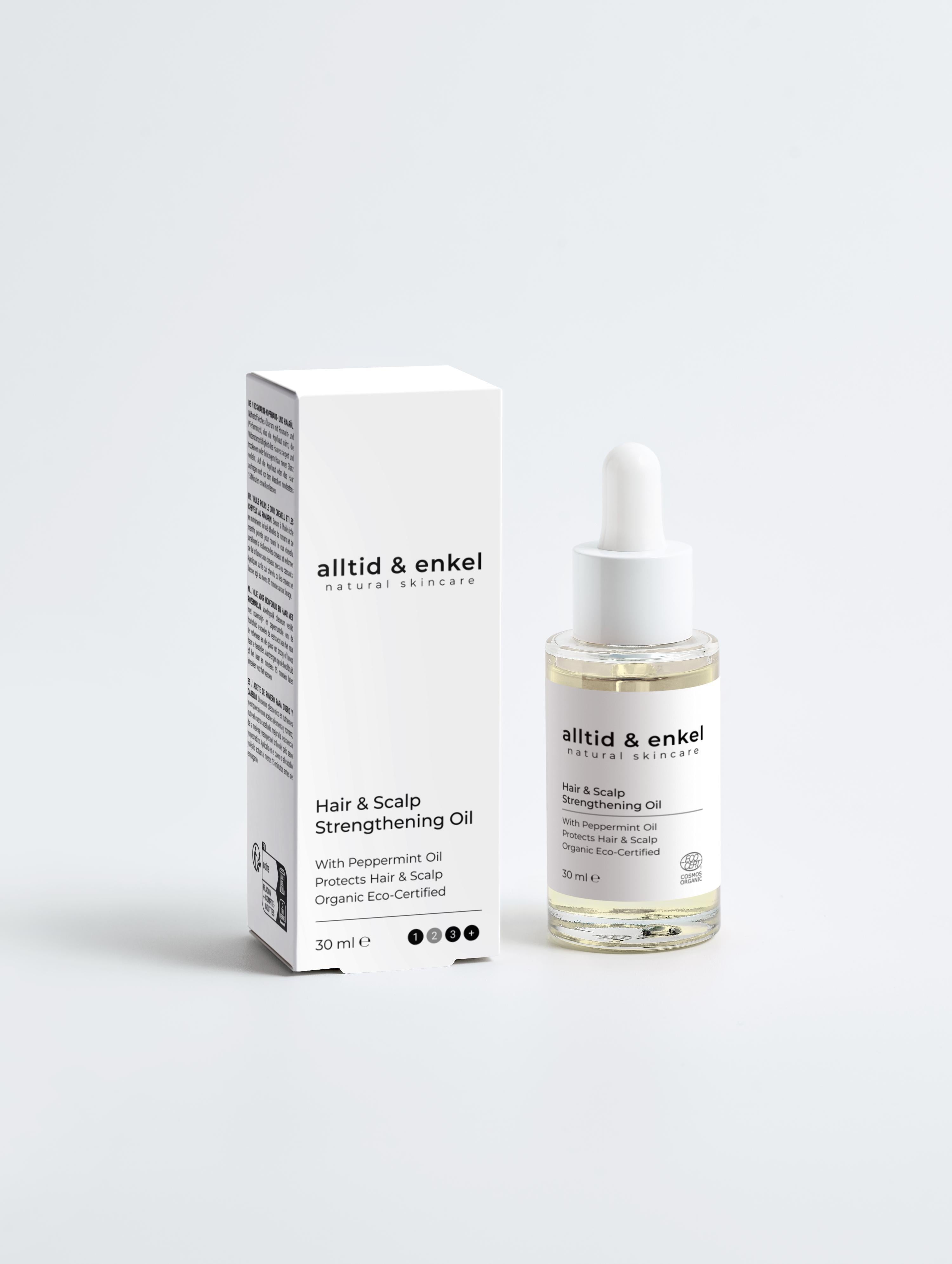 Hair & Scalp Strengthening Oil with pepperming oil next to its packaging box, 30 ml.