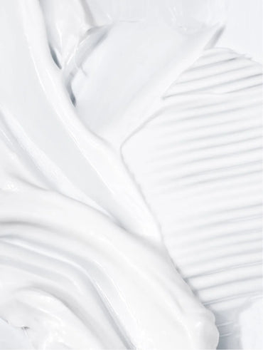 Close-up of silky skin serum texture.