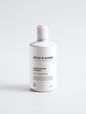 Strengthening shampoo in a sleek white bottle on a white background, 290 ml.