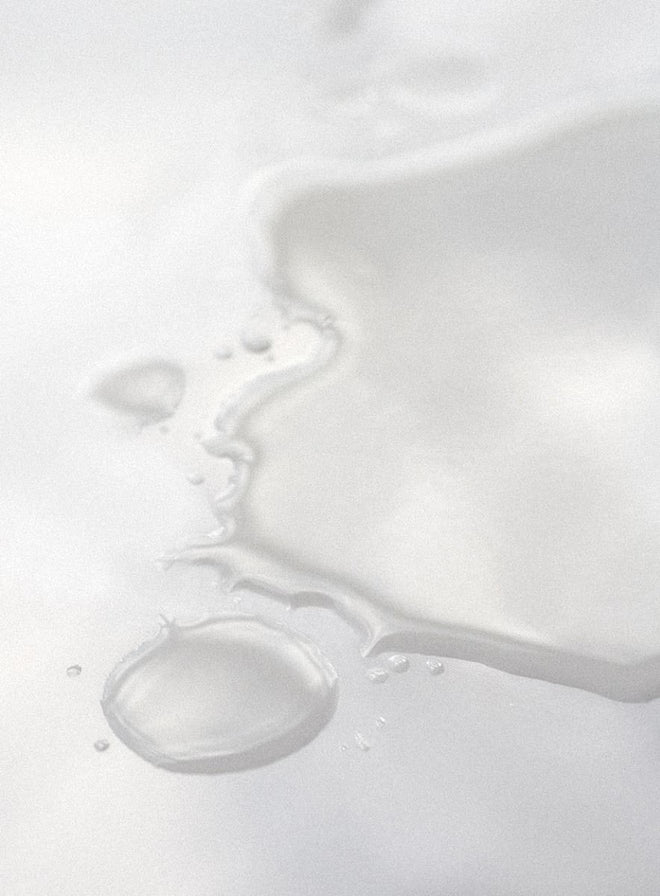 Close-up of hydrating toner texture on a white background.