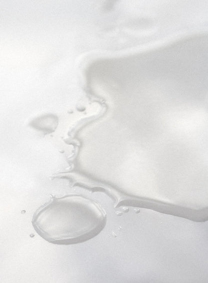 Close-up of hydrating toner texture on a white background.