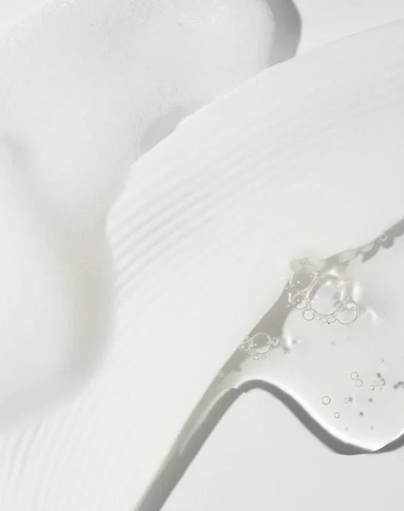 Close-up of hydrating toner texture on a white background.