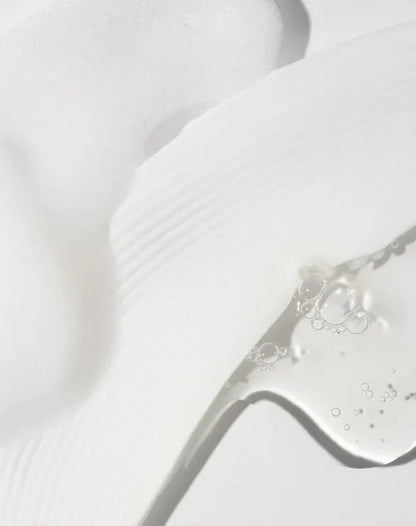 Close-up of hydrating toner texture on a white background.