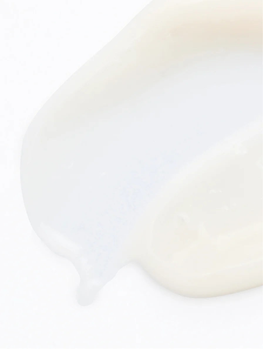 Close-up of pigment perfecting serum texture on a white background.