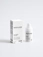 Acne spot care gel in a sleek white bottle with box on a white background, 15 ml.