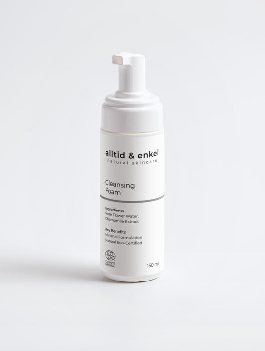 Cleansing foam in a sleek white bottle on a white background, 150 ml.