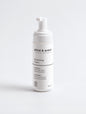 Cleansing foam in a sleek white bottle on a white background, 150 ml.