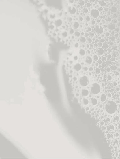 Gray textured water, showing a soft shadow.