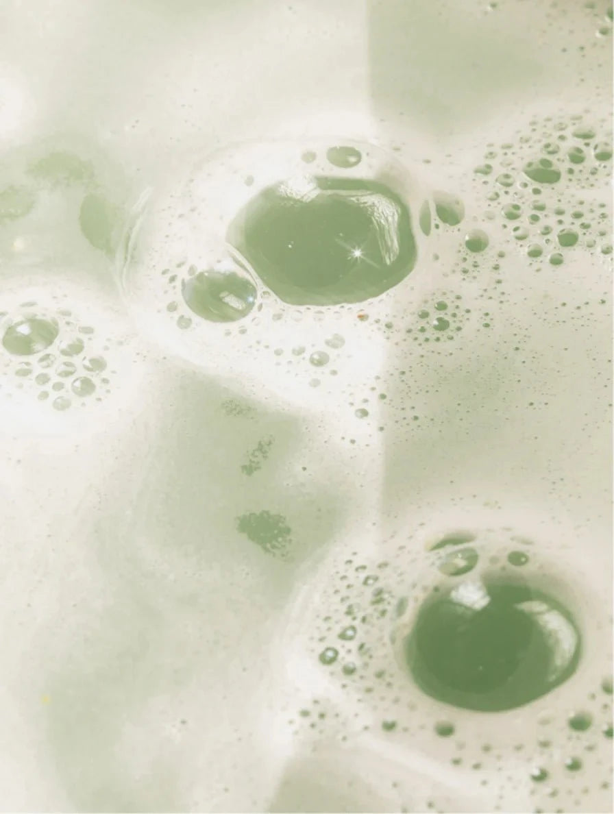 Close-up of green bubbles on a light background