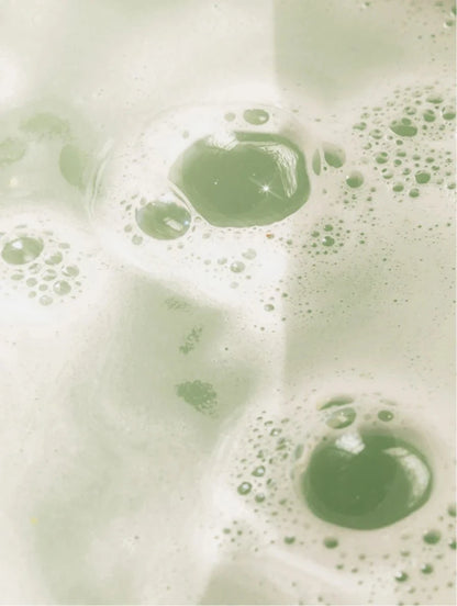 Close-up of green bubbles on a light background