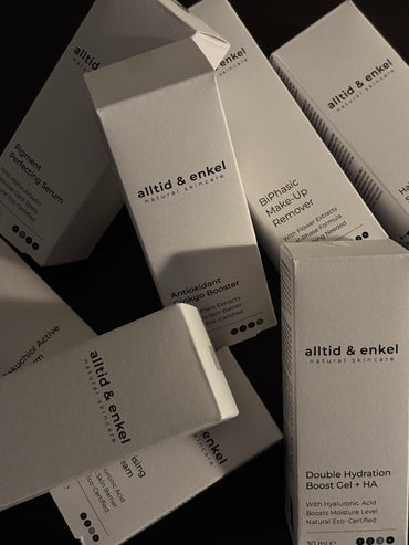alltid & enkel skincare product boxes on a black background