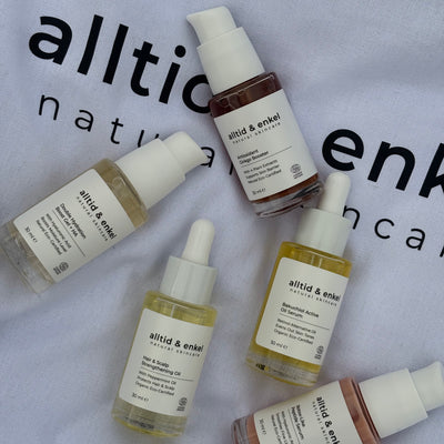 Various natural skincare bottles with antioxidant products on a light gray background.