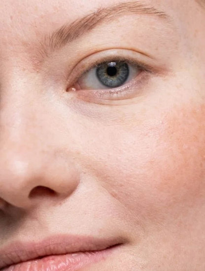 Close-up of a person's eye with a light background